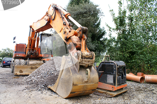 Image of excavator working at the construction site