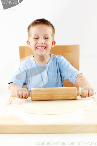 Image of Small boy baking cookies