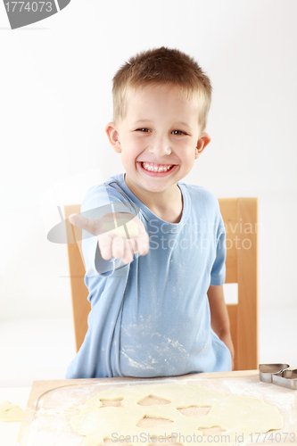 Image of Boy baking cookies