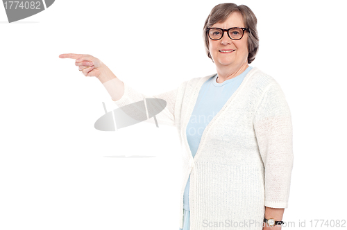 Image of Beautiful old lady pointing away