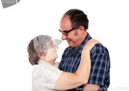 Image of Aged couple in a romantic mood