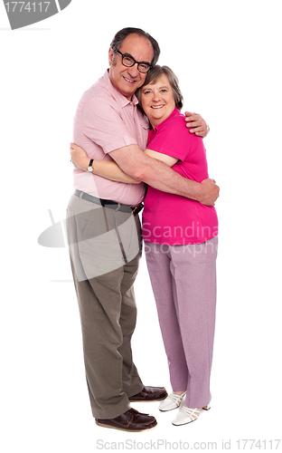 Image of Happy aged woman hugging her husband