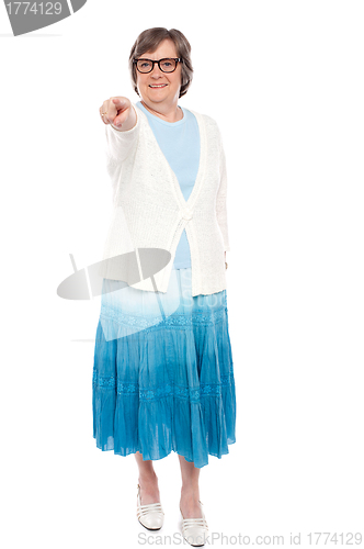 Image of Fashionable woman pointing at you