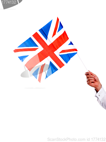 Image of Image of males hand holding UK flag