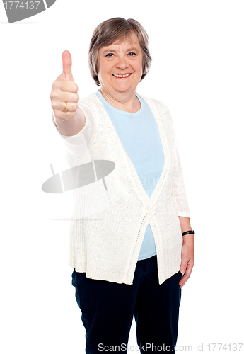 Image of Smiling old lady showing thumbs up gesture