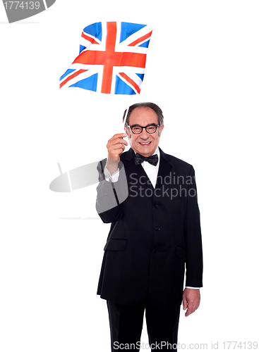 Image of Senior UK supporter holding nations flag