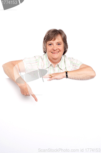 Image of Beautiful old lady pointing at whiteboard