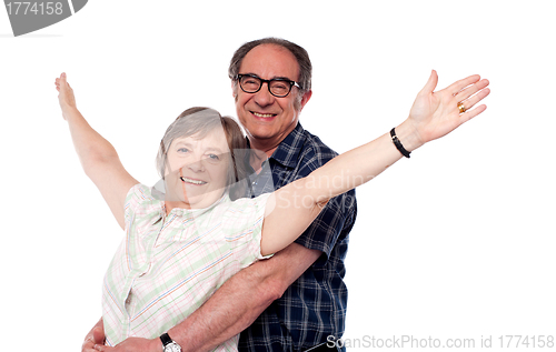 Image of Mature woman with arms outstretched
