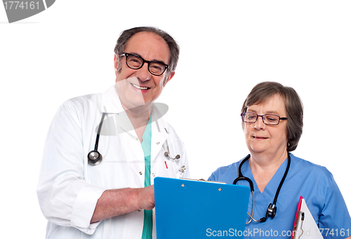 Image of Senior doctors reading medical report