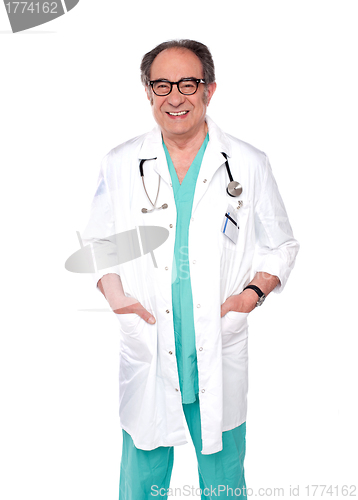 Image of Aged surgeon with hand in pocket