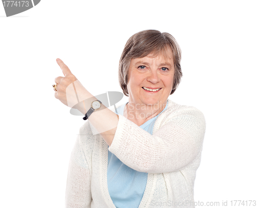 Image of Beautiful senior woman indicating copy space