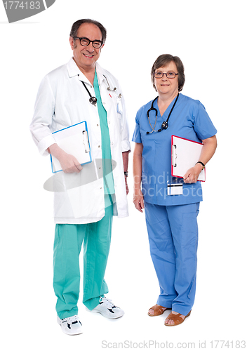 Image of Senior male doctor posing with female nurse