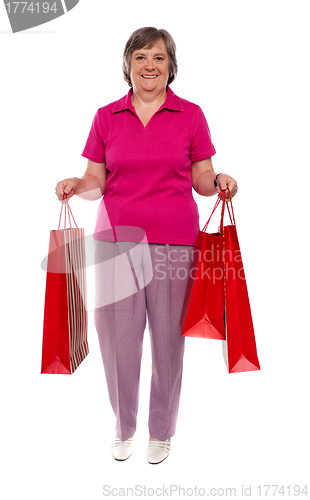 Image of Woman holding shopping bags
