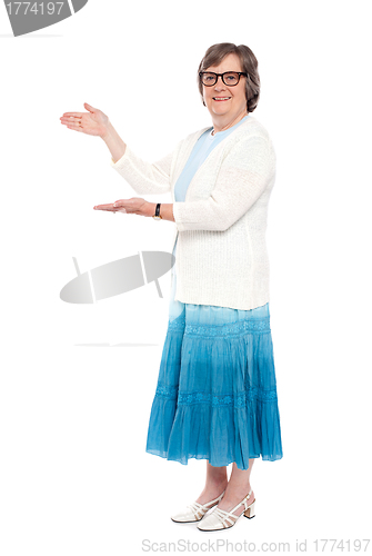 Image of Beautiful aged female showing copy space