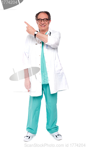 Image of Full length image of doctor indicating up