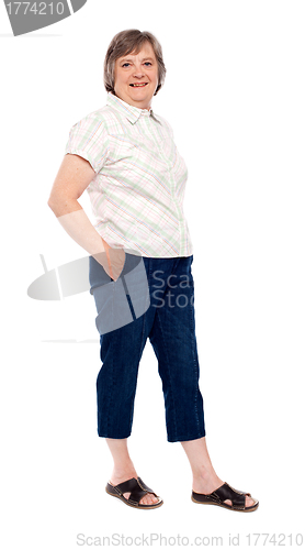 Image of Old lady posing with hands in pocket