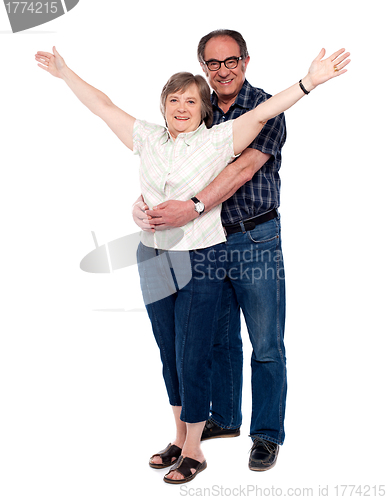 Image of Man hugging his wife from behind