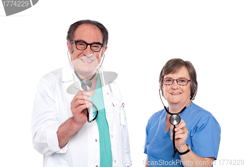 Image of Smiling aged male and female doctors