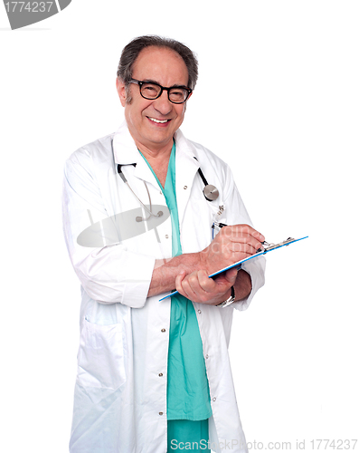 Image of Friendly male doctor with a clipboard