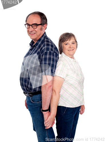 Image of Affectionate couple posing back to back