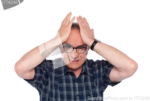 Image of Old man having headache