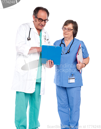 Image of Doctors discussing a medical report