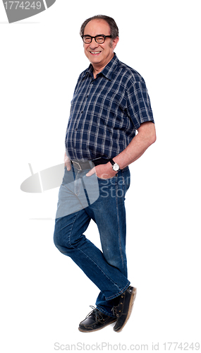 Image of Old handsome man standing in style