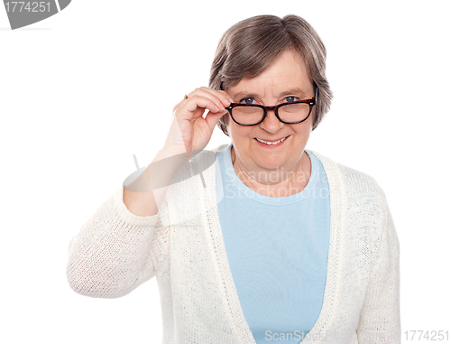 Image of Attractive female holding her eyeglasses
