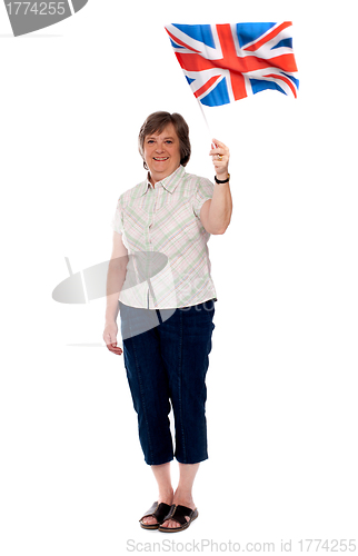 Image of British fan waving her country flag