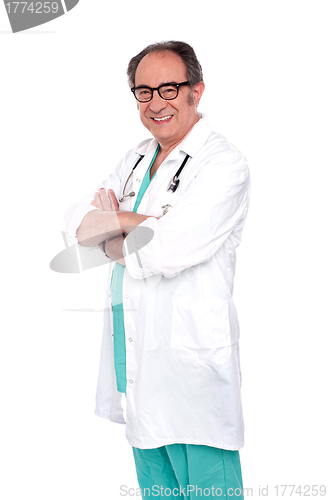 Image of Portrait of smiling senior male surgeon