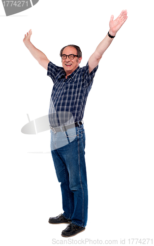 Image of Mature man standing with open arms