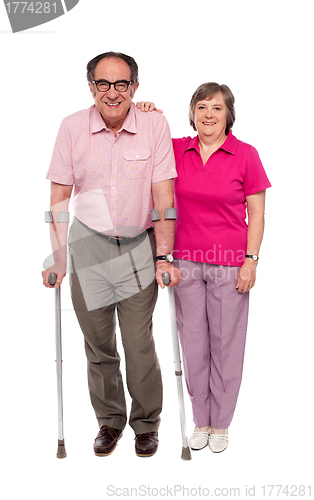 Image of Woman supporting her handicapped husband