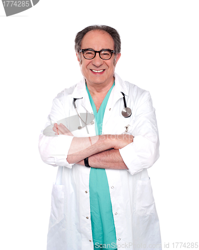 Image of Senior doctor posing with arms crossed