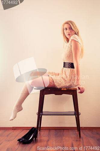 Image of Beautiful model sitting on table