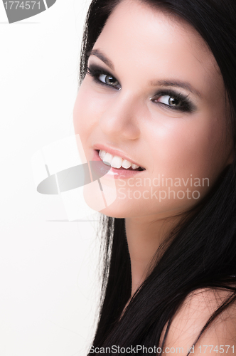 Image of Closeup of a cheerful young woman smiling