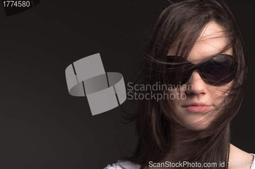 Image of Young woman with sunglasses