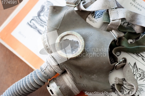 Image of Gasmask on a book for children