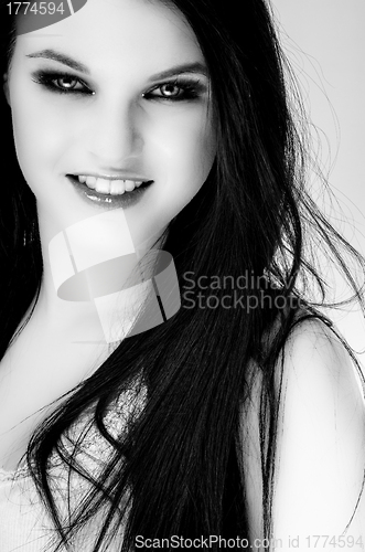 Image of Closeup of a cheerful young woman smiling