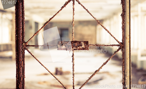 Image of Vintage broken window with blurry corridor