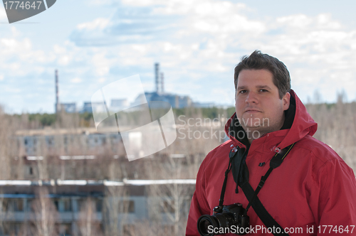 Image of Handsome young explorer and the power plant