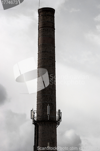 Image of Big industrial chimney against sky