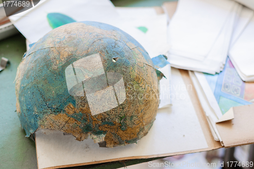 Image of Abandoned and broken globe in a school 