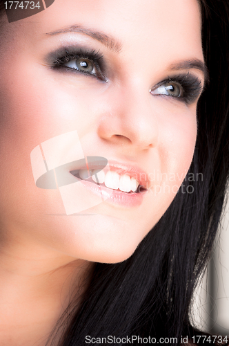 Image of Closeup of a cheerful young woman smiling