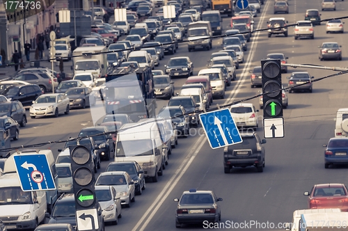 Image of Green traffic lamps and blue sign