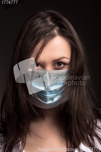 Image of Young woman in a protective mask