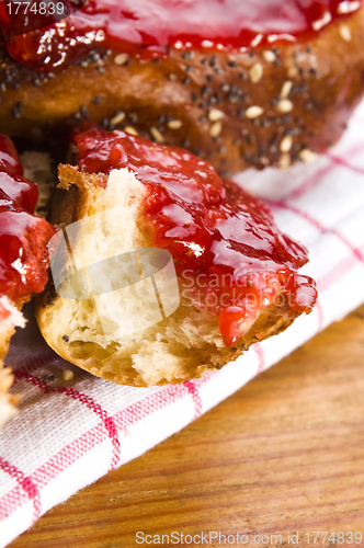 Image of Sweet bread ( challah ) with strawberry jam