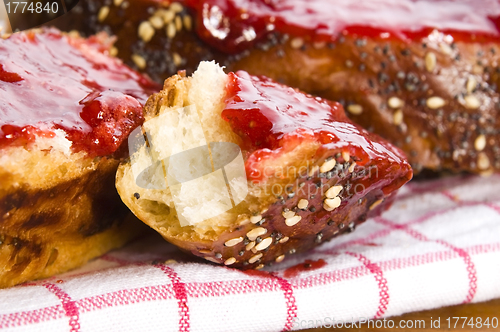 Image of Sweet bread ( challah ) with strawberry jam