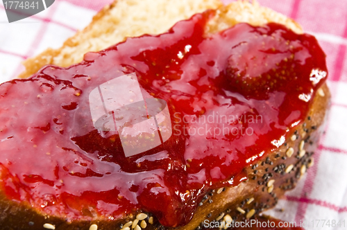 Image of Sweet bread ( challah ) with strawberry jam
