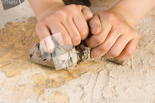 Image of Child hands of a potter
