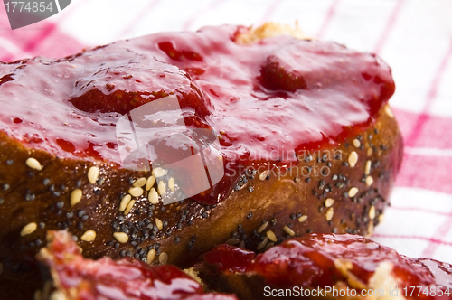 Image of Sweet bread ( challah ) with strawberry jam